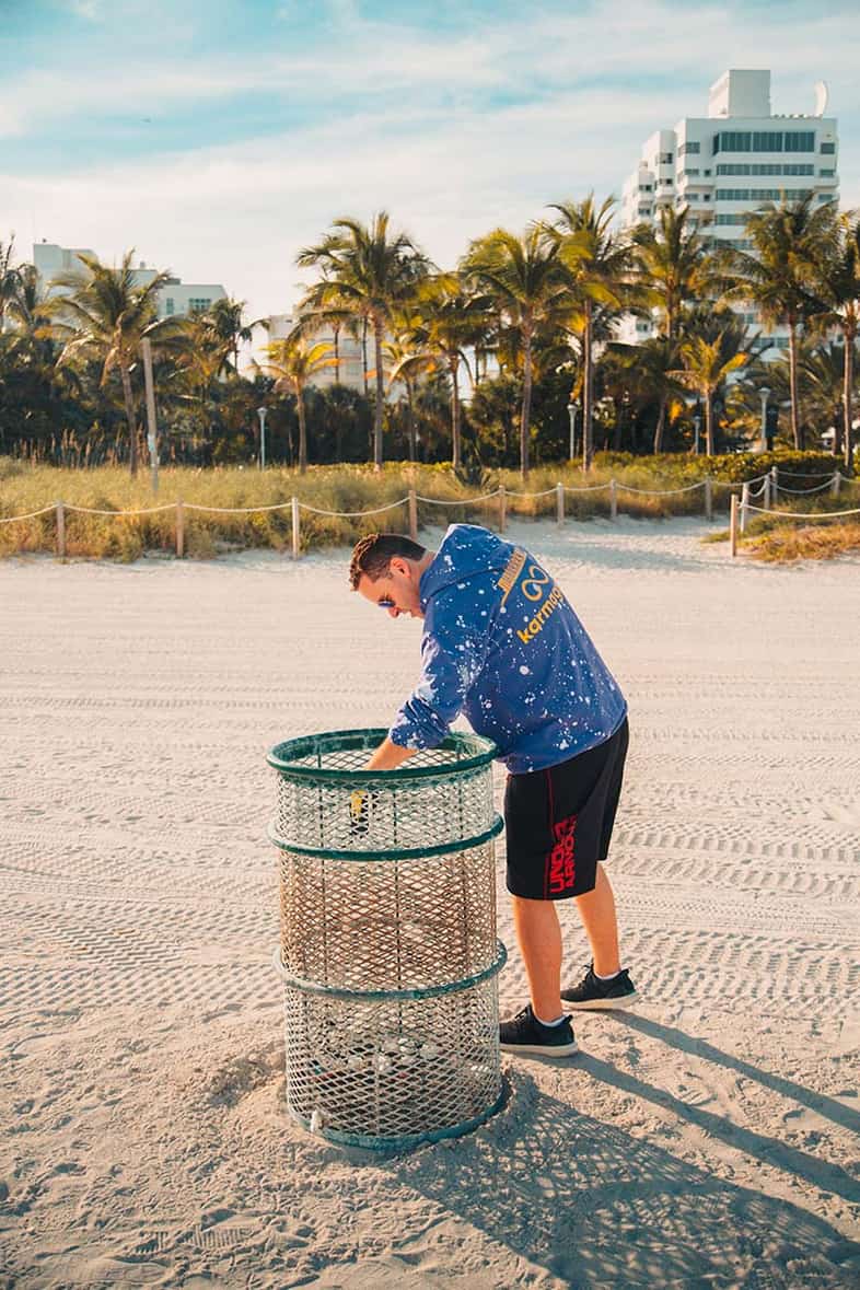 Tim Sykes cleans up beach trash, December 5, 2019 in Miami, Florida