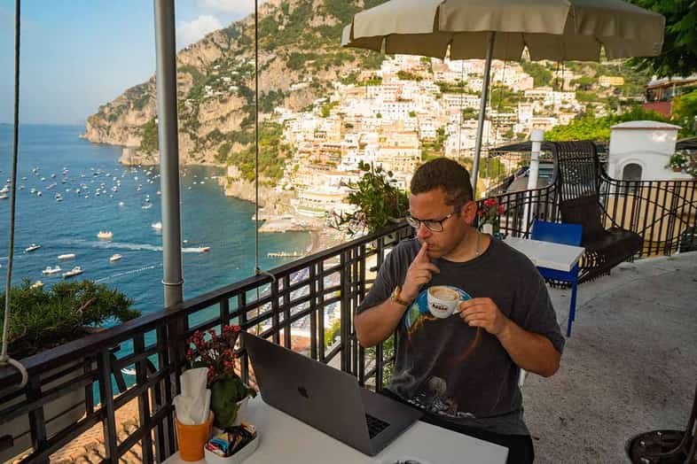 top penny stocks list September 13, 2021 Tim Sykes drinks coffee in Positano Italy working on Mindset Master